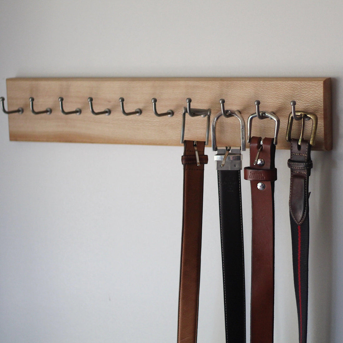 How to Use a Belt Hanger to Organize Your Belts - Anvil Hide